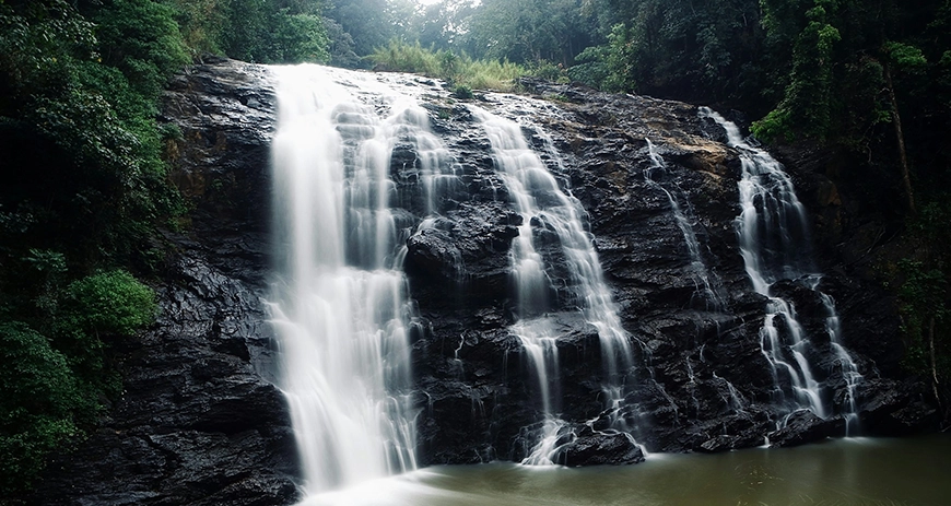 Experience Coorg’s coffee farms, fog-covered hills, and vibrant culture, perfect for adventurers.